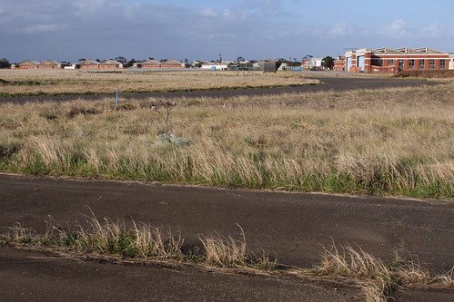 Looking over the abandoned RAAF Williams airfield towards the hangars
