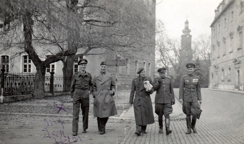 British, American and Soviet officers. Unidentified city.