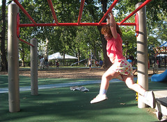 Speck hangs from the low monkey bars