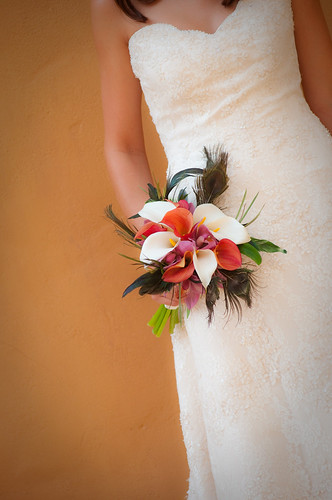 Bridal bouquet with calla lilies and peacock feathers