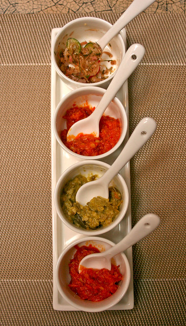 Several types of chillies and condiments are served