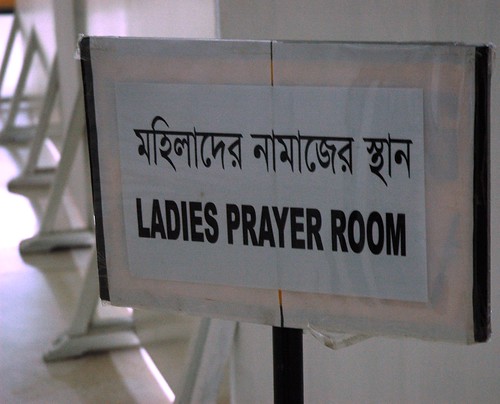 Ladies prayer room sign, with temporary walls set up for privacy, they were a bit surprized to see a white western woman in levis practicing Buddhism, Bangladesh is predominately Islamic, genders are separated, Dhaka, Bangladesh by Wonderlane
