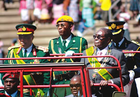 PRESIDENT Mugabe inspects a parade in the company of Zimbabwe Defence Forces Commander General Constantine Guveya Chiwenga  during the 31st ZDF Day celebrations at the National Sports Stadium in Harare August 10, 2011. by Pan-African News Wire File Photos