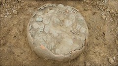 ceramic pot of coins