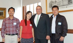 Gov. Paul LePage poses with three Chinese guest teachers.