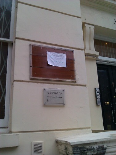 Libyan embassy plaque with a drenched paper above