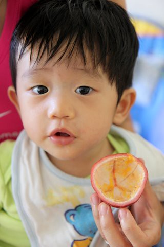 Ethan_eatingpassionfruit