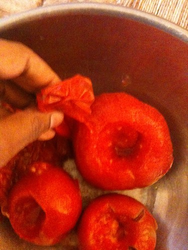 Peeling the tomatoes