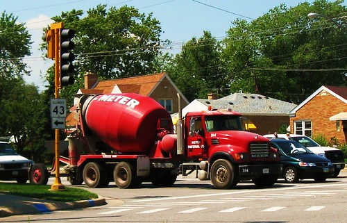 A red Mack cement mixer truck from Meyer Materials Company.  Niles Illinois USA.  August 2011. by Eddie from Chicago