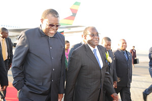 President Robert Mugabe of Zimbabwe with Namibian Minister of Trade and Industry Hage Geingob during a visit by the head of state on August 10, 2011. The two parties, ZANU-PF and SWAPO, have enjoyed fraternal relations since the liberation wars. by Pan-African News Wire File Photos