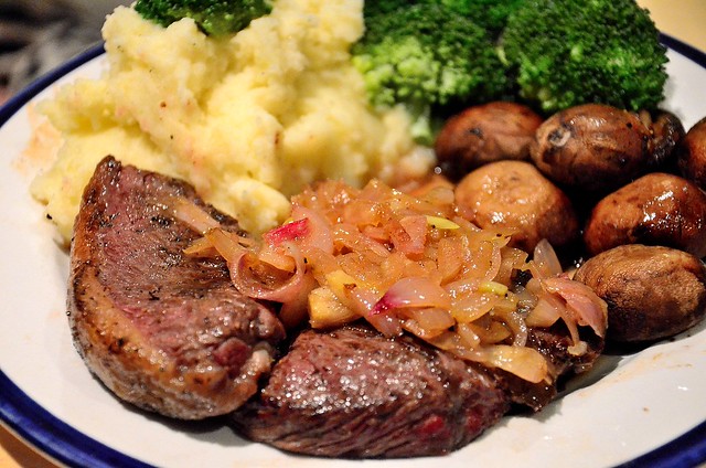 Homemade rare steak with roasted vegetables and creamy mash