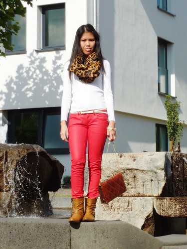 colored jeans with animal print scarf