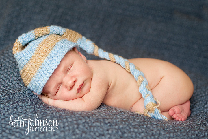 newborn baby boy in blue and brown elf hat