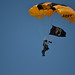 The POW-MIA flag being parachuted in.