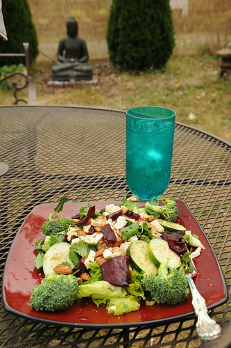 Healthy eating: Summer salad with a tumbler of sparkling water, blessed Buddha statue, outside in the yard, Broadview, Seattle, Washington, USA by Wonderlane