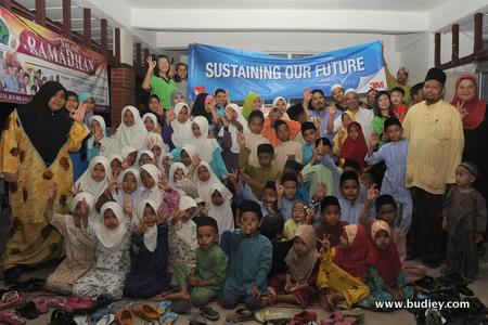 1. 3M Seremban staff with smiling children from Baitul Mahabbah