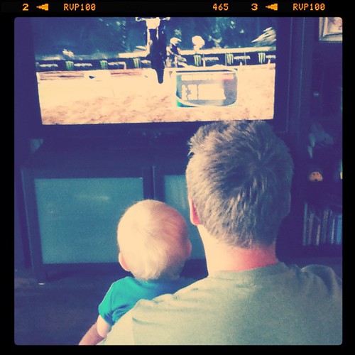 Uh oh! He's liking and watching dirt biking with Daddy!