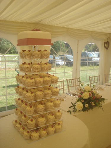 A Dusky Pink vintage tower with handmade roses and ivory lace cupcake 