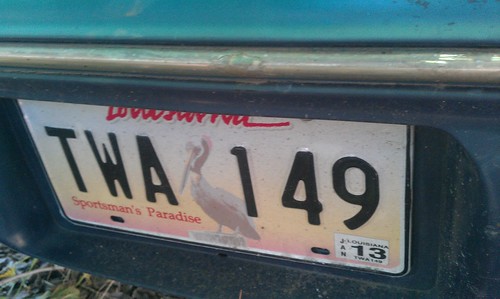 License plate on abandoned car on Bibleway Lot