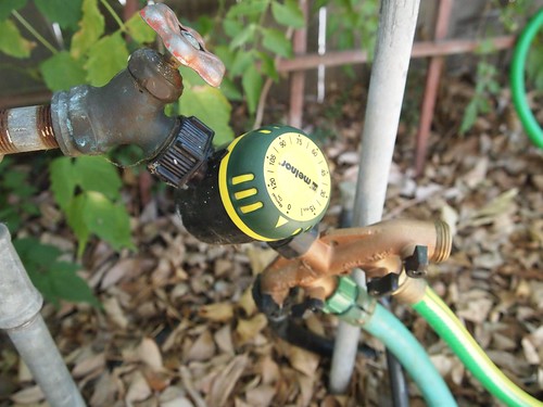 Soaker hose timer and manifold