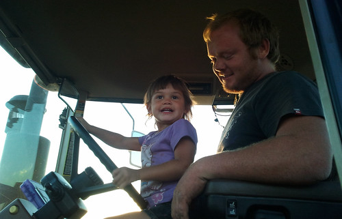 Johan helps Kaidence drive the grain cart