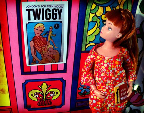 Unhappy with her looks, a redhead Dollikin doll looks to modeling sensation Twiggy for "thinspiration."