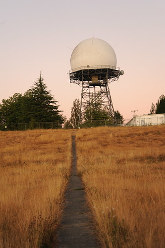 Radar tower in the form of Supermans snowball, path through the golden grass of August, Discovery Park, Seattle, Washington, USA by Wonderlane
