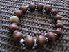 Sterling silver, teak wood with horn bead