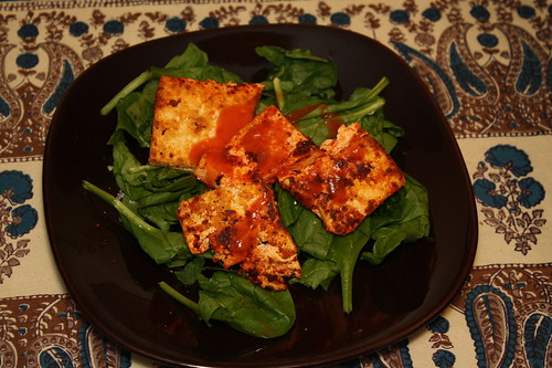 Tofu on bed of spinach