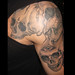 skulls on arm tattoo