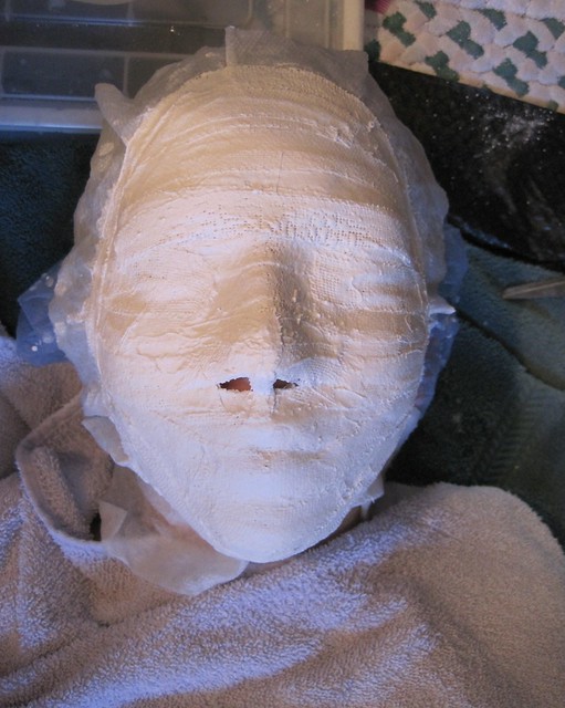 on face before being trimmed but after all the pieces are laid on face