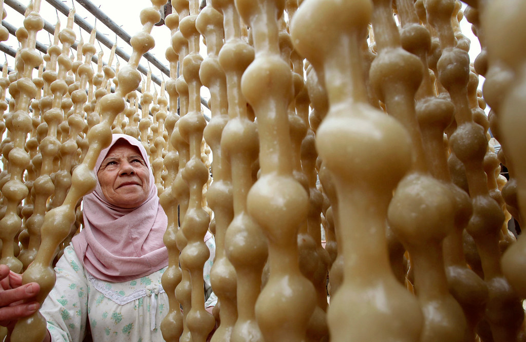 A woman prepares traditional sweets for sale