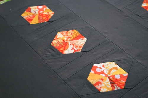gray and orange scrap quilt