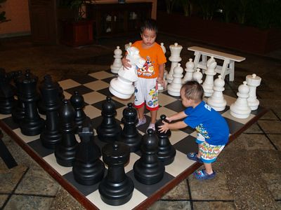 Boys on giant chess board