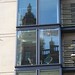 Harrods London through the windows of surrounding buildings
