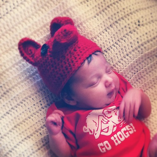 Curled up on the couch, watching her first Razorback football game. #wps
