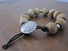 Sterling silver and rare wooden beads with native coin