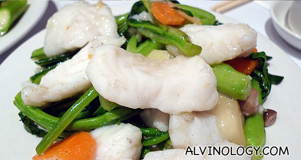 Delicious cod fish stirred fried with veggies