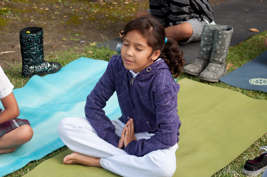 Gabrielle Lagman teaching yoga to Vaughn Elementary School