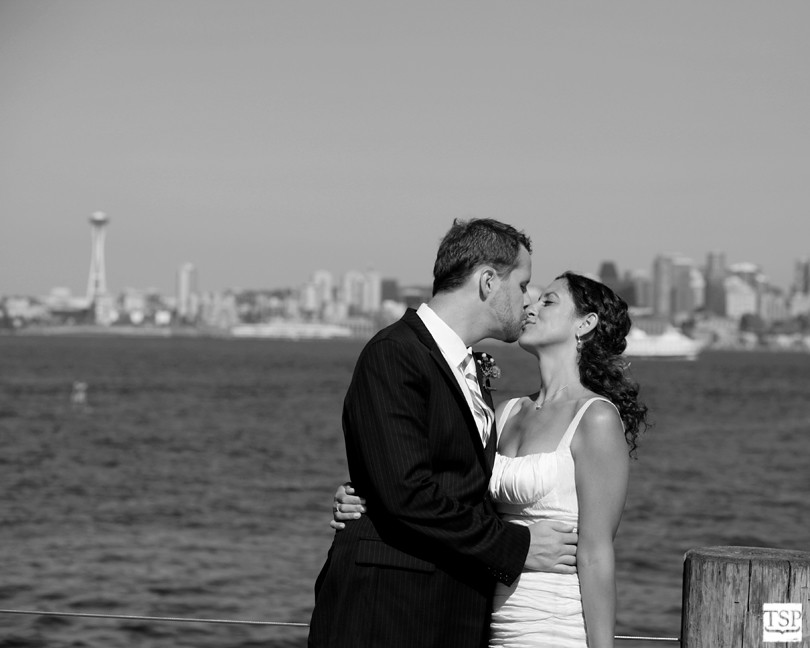 Bride and Groom Kissing in Front of Seattle Space Needle