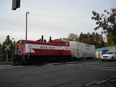 OPR 1202 pushes a refrigerator car into a siding in the Milwaukie industrial park