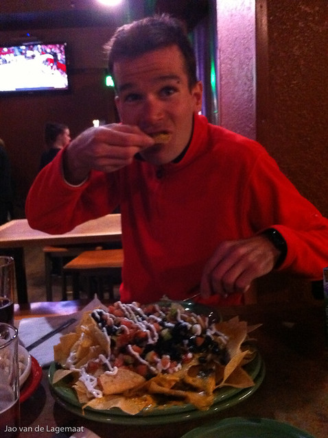 Jean David at Tommyknocker eating the traditional enormous plate of nachos.