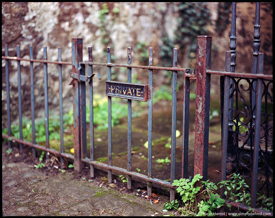 Private sign on rusty railings