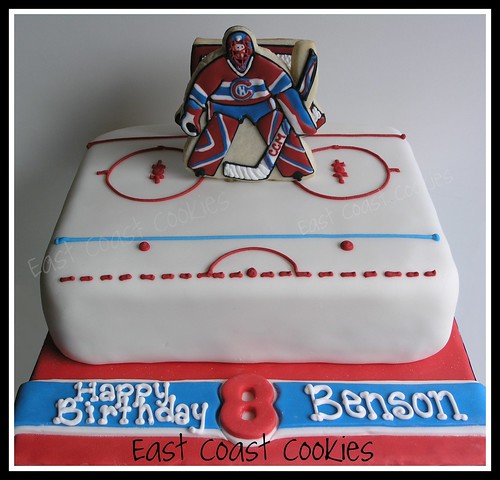 Goalie (Hockey) Cake with decorated cookies.