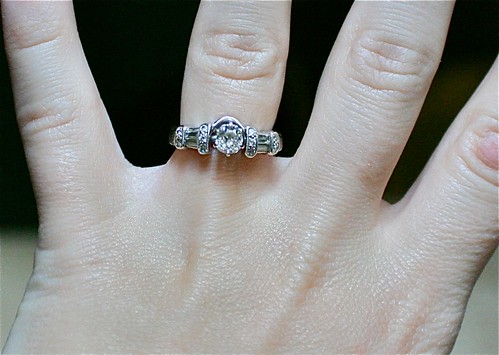 The engagement ring was the simple solitaire and the wrap around it is my 