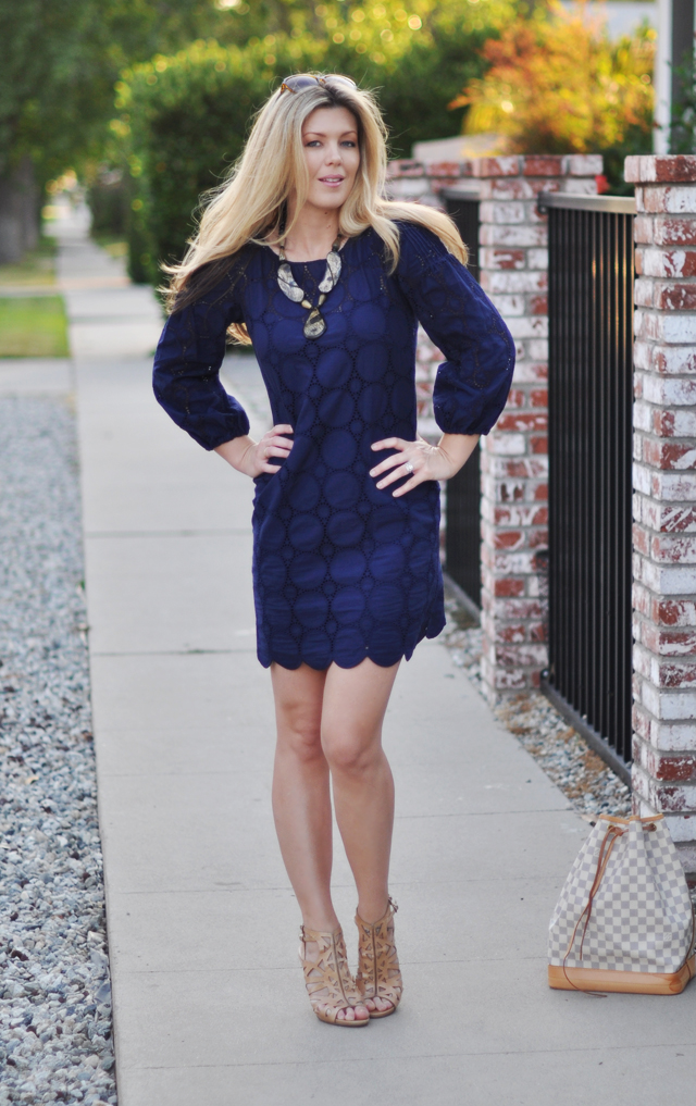 navy crocheted circle mini dress with nude shoes