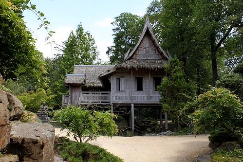wooden house on poles in garden