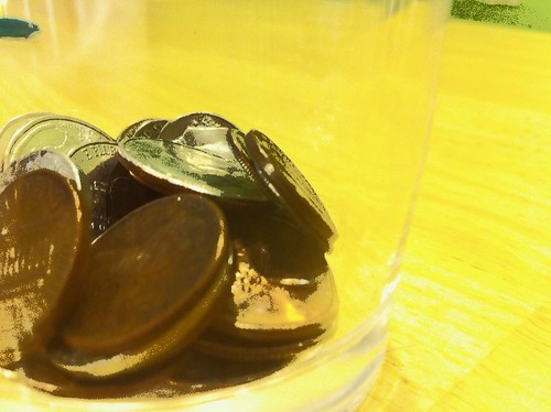 Glass with coins