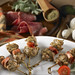 Tender ribboned pieces of veal and proscuittini delicately seasoned on a skewer.