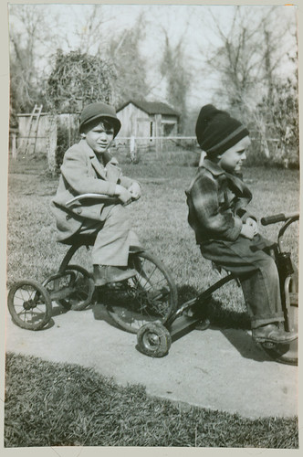 Two children on tricycles